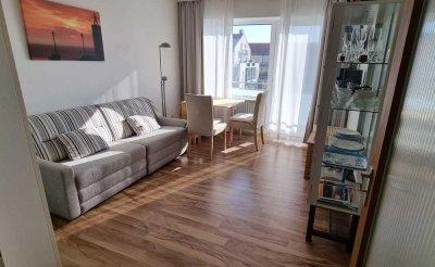 Wohlfühloase auf Wangerooge – charmante Ferienwohnung in Toplage mit Balkon mit seitlichen Meerblick