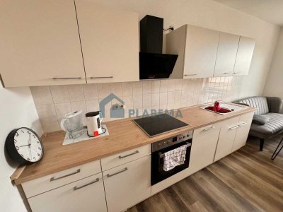 Gemütliche 2-Zimmer-Wohnung, neue Einbauküche, tolles Gemeinschaftsgrundstück