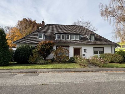 Einfamilienhaus mit Gewerbeeinheit, Garten und Garage