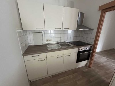 Gemütliche Wohnung mit Einbauküche und Dachterrasse!