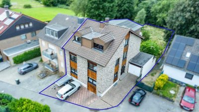 Familienfreundliches Dreifamilienhaus mit Garten und Stellplätzen in bevorzugter Wohnlage