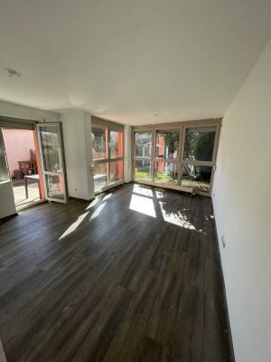 EG-Wohnung mit Terrasse, Gartenanteil & Tiefgaragenstellplatz
