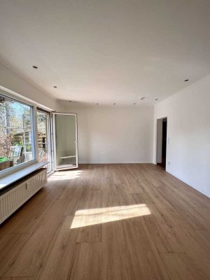 Lichtdurchflutete, sanierte 3-Zimmer-Wohnung mit Terrasse, Gartenanteil & TG - sofort verlieben