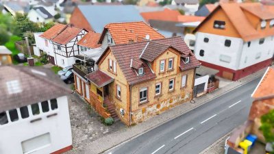 Großzügiges Mehrfamilienhaus mit 3 Wohneinheiten, Gewerbeflächen, Gartenidylle & Potenzial