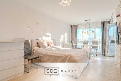 Wohnen mit Aussicht: Stilvolle 1-Zimmer-Wohnung mit Balkon und Alpenblick