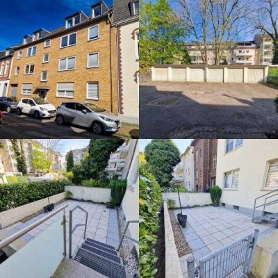 Erdgeschosswohnung mit Terrasse, Balkon und zwei Garagen in ruhiger Einbahnstraße.