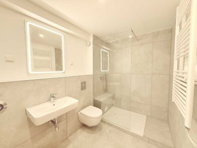 Erstbezug: Exklusive 2-Raum Wohnung mit Fußbodenheizung, EBK, Terrasse, Garten & Tiefgarage