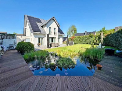 Freistehendes Einfamilienhaus mit Einliegerwohnung und Gartenidylle