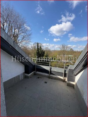 Helle Dachgeschosswohnung mit großer Sonnenterrasse & Garage in gepflegtem Mehrfamilienhaus