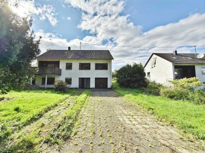 Zwischen Wald und Wiese - Einfamilienhaus inklusive Einliegerwohnung mit großem Potential