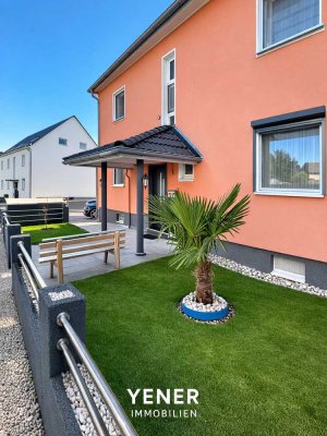 Exklusives Zweifamilienhaus mit Photovoltaik, fünf Garagen und großem Grundstück