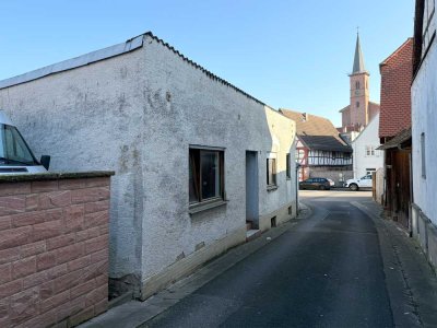 Bungalow mit Sanierungsbedarf in bester Lage