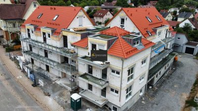Stadtwohnung! Neubau 3 Zimmer mit EBK, Balkon und Tiefgarage und Möglichkeit für E Mobilität