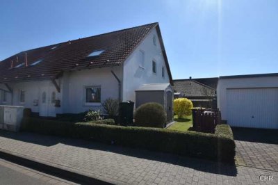 Großzügige Eigentumswohnung mit sonniger Terrasse, Garage und eigenem Gartenanteil