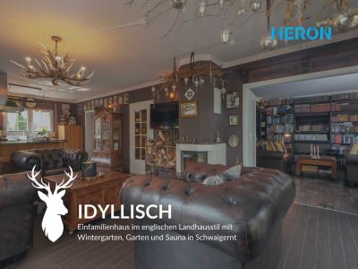 IDYLLISCH - Effizientes Einfamilienhaus, mit Wintergarten und Einliegerwohnung in einer grünen Oase.