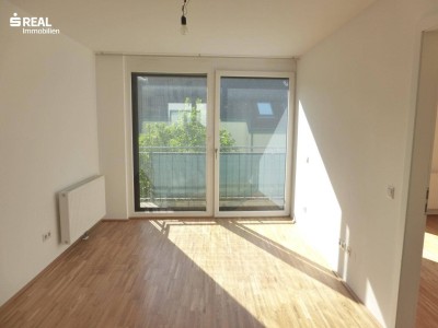 Attraktive, sonnige Neubauwohnung mit Balkon und Garagenplatz - 32 m² (!) Wohnzimmer