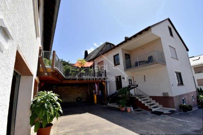 Wohnen und verdienen: Zwei Häuser mit etabliertem Ferienwohnungsbetrieb