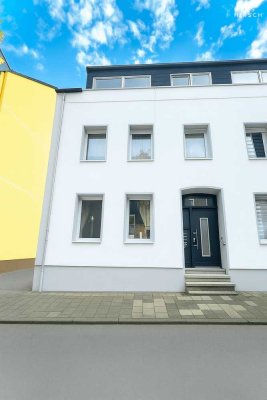 Exklusives Wohnvergnügen im Grünen: Erdgeschosswohnung mit Gemeinschaftsgarten & 2 Badezimmern!