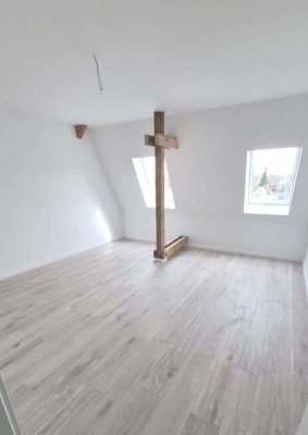 Charmante Dachgeschosswohnung in saniertem Denkmalobjekt im Herzen von Grimmen