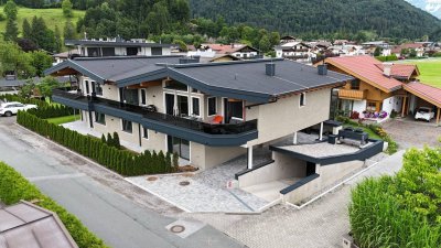 Exklusives Wohnen in Ruhelage – Neubau mit nur vier Wohneinheiten in Kössen, Top 2 im Erdgeschoss