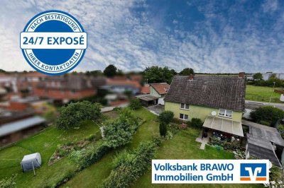 Zweifamilienhaus mit großem Gartengrundstück für Ihren Neubau