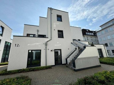 Helle Drei-Zimmer Wohnung mit Einbauküche und Terrasse in ruhiger Lage nahe dem Zentrum