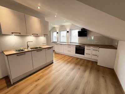 Erstbezug im Neubau DG - Exklusive 2,5 ZKB mit Balkon und Einbauküche - Fussbodenheizung