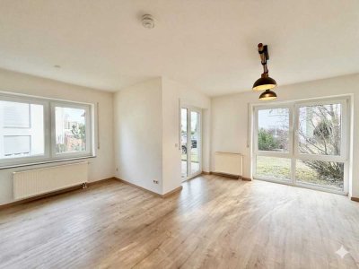 Moderne 2-Zimmer-Wohnung im EGmit Terrasse, Garten und TG-Stellplatz
