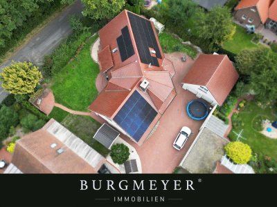 LOHNE: Besondere Architektur gewünscht - einmaliges Einfamilienhaus in ruhiger Siedlungslage
