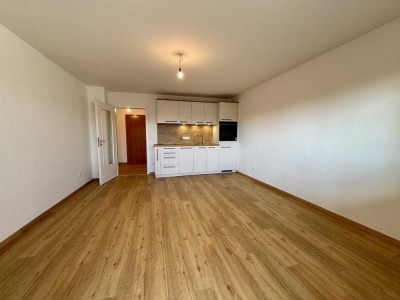 Erstbezug nach Sanierung - Schickes Appartement mit Einbauküche, Dachterrasse und TG-Stellplatz