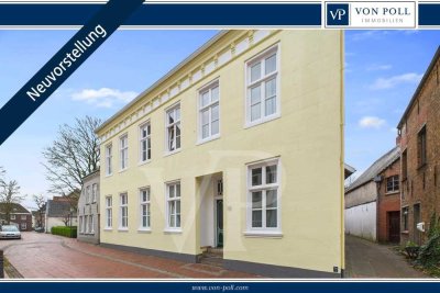 Wohnen mit Geschichte: Denkmalgeschützte Erdgeschosswohnung mit Terrasse & Carport in Weener