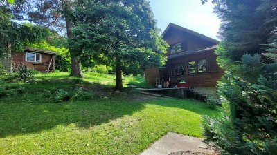 NEUER PREIS! Ausbaufähiges Holzhaus in Grünlage!