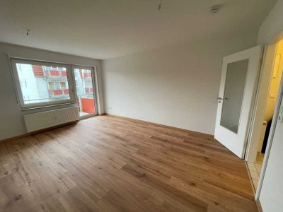 Moderne 1-Zimmer-Wohnung mit Balkon und Tiefgarage in ruhiger, grüner Lage