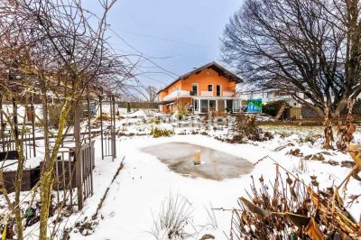 Großzügiges Anwesen mit energetischer Sanierung und hochwertiger Gartengestaltung im Alpenvorland