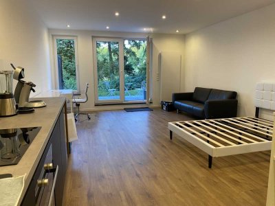 Exklusive möblierte 1-Raum-Erstbezug-Souterrain-Wohnung mit gehobener Innenausstattung & Terrasse