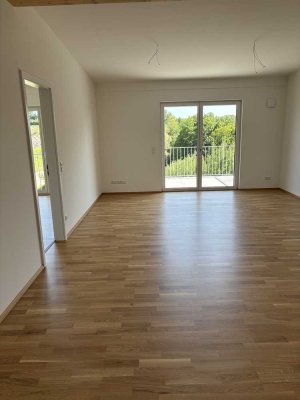 Erstbezug mit Balkon: Freundliche 2-Zimmer-DG-Wohnung