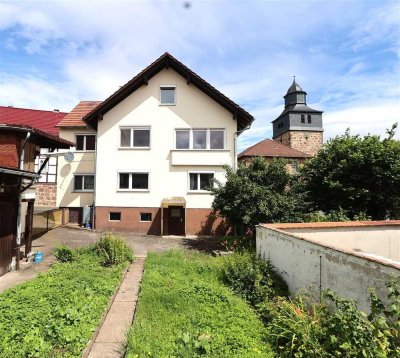 Bezahlbar und Familienfreundlich: Massives Einfamilienhaus mit viel Platz, Garten und Garage