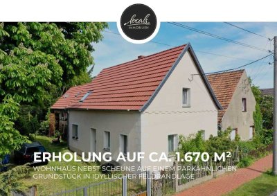Ländliches Idyll trifft auf charmante Vielseitigkeit - Einfamilienhaus, Stallgebäude und Traumgarten