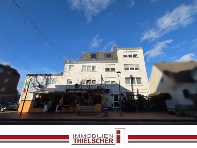 Attraktive Eigentumswohnung mit Dachterrasse und Garage in gepflegtem Wohn- und Geschäftshaus