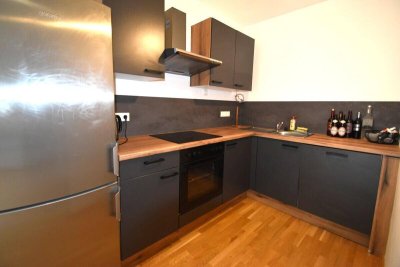 Vermietete Anlegerwohnung mit Tiefgaragenstellplatz in zentraler Grünruhelage