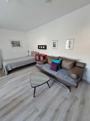 Helle, möblierte 1-Zimmerwohnung mit Küche und Gemeinschaftsgarten