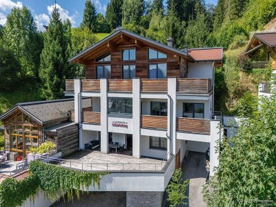 Naturnah &amp; zentral: Stilvolle 4-Zimmer Erdgeschosswohnung mit großer Terrasse in Ski amadé-Nähe