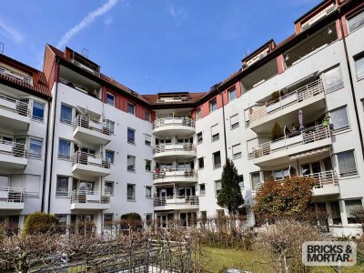 Traumhafte 3-Zimmer-Wohnung mit Garten & Brunnenidylle im Innenhof