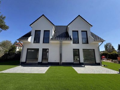 Modern semi-detached house with basement living space and carport