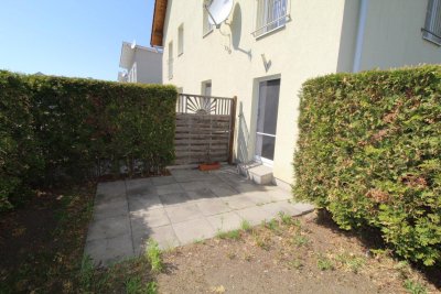 GARTENWOHNUNG in SCHNELLBAHNNÄHE mit Fußbodenheizung, Parkplatz und großem Kellerabteil
