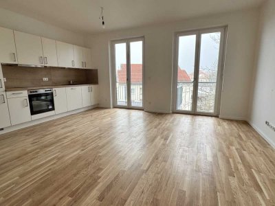 Erstbezug: Geräumige 4-Zimmer-Wohnung mit Balkon, hochwertiger EBK und 2 Bädern