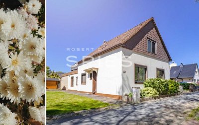 Großzügige Immobilie mit einem gepflegten Garten und Platz für bis zu zwei Parteien