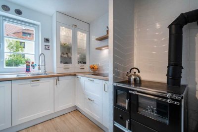 Einzigartiges Top-saniertes Reihenmittelhaus mit kleinem Garten.