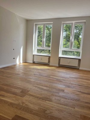 Erstbezug! Exklusive Drei-Zimmer-Wohnung mit Wohnküche in Parklage!
