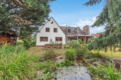 Mehrfamilienhaus mit Laden, Werkstatt und vielen Extras 
auf herrlich großem Grundstück.

Erlange